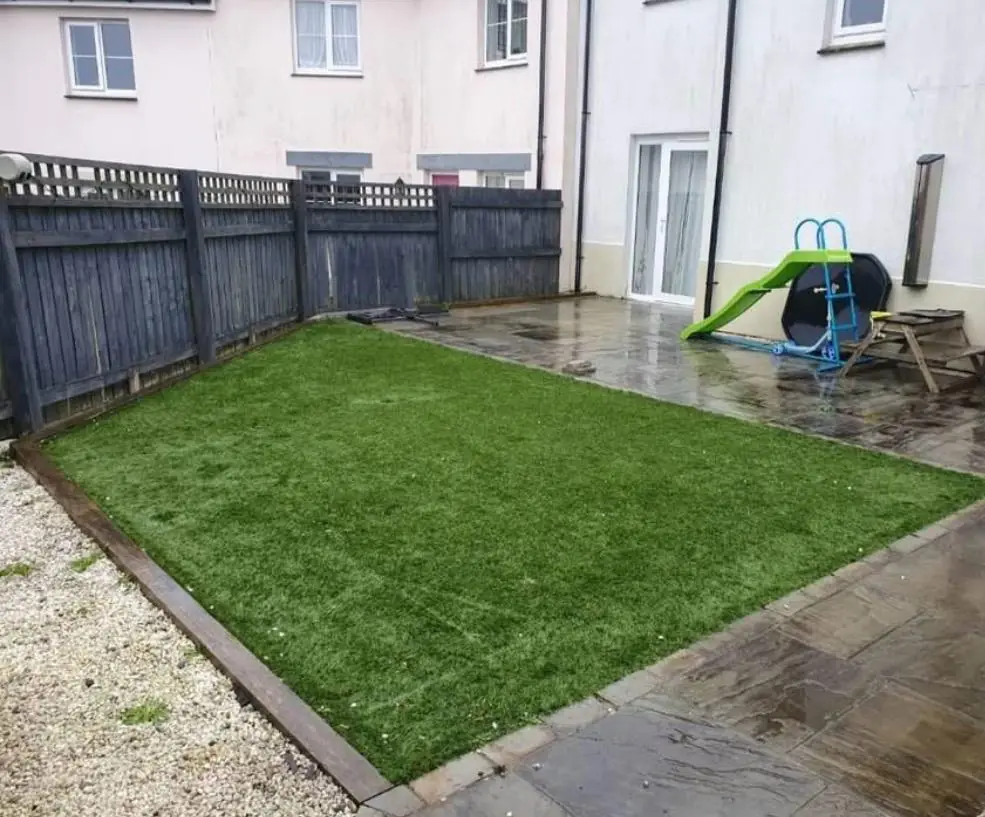 After. Cleared and a new lawn laid, slide and bench the only things standing.