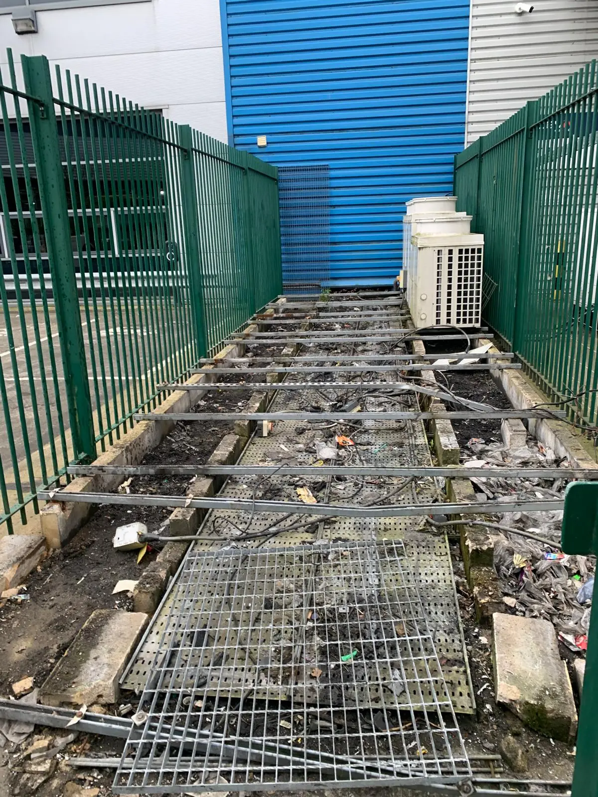 After. Condensers and grating removed, deck taken back to bare concrete.