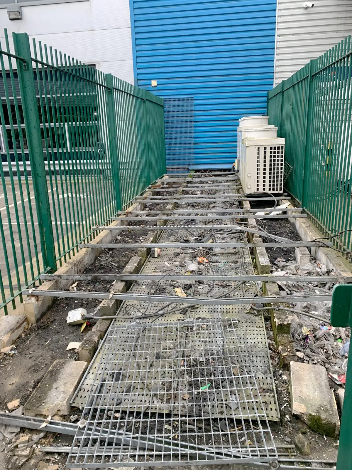 After. Condensers and grating removed, deck taken back to bare concrete.