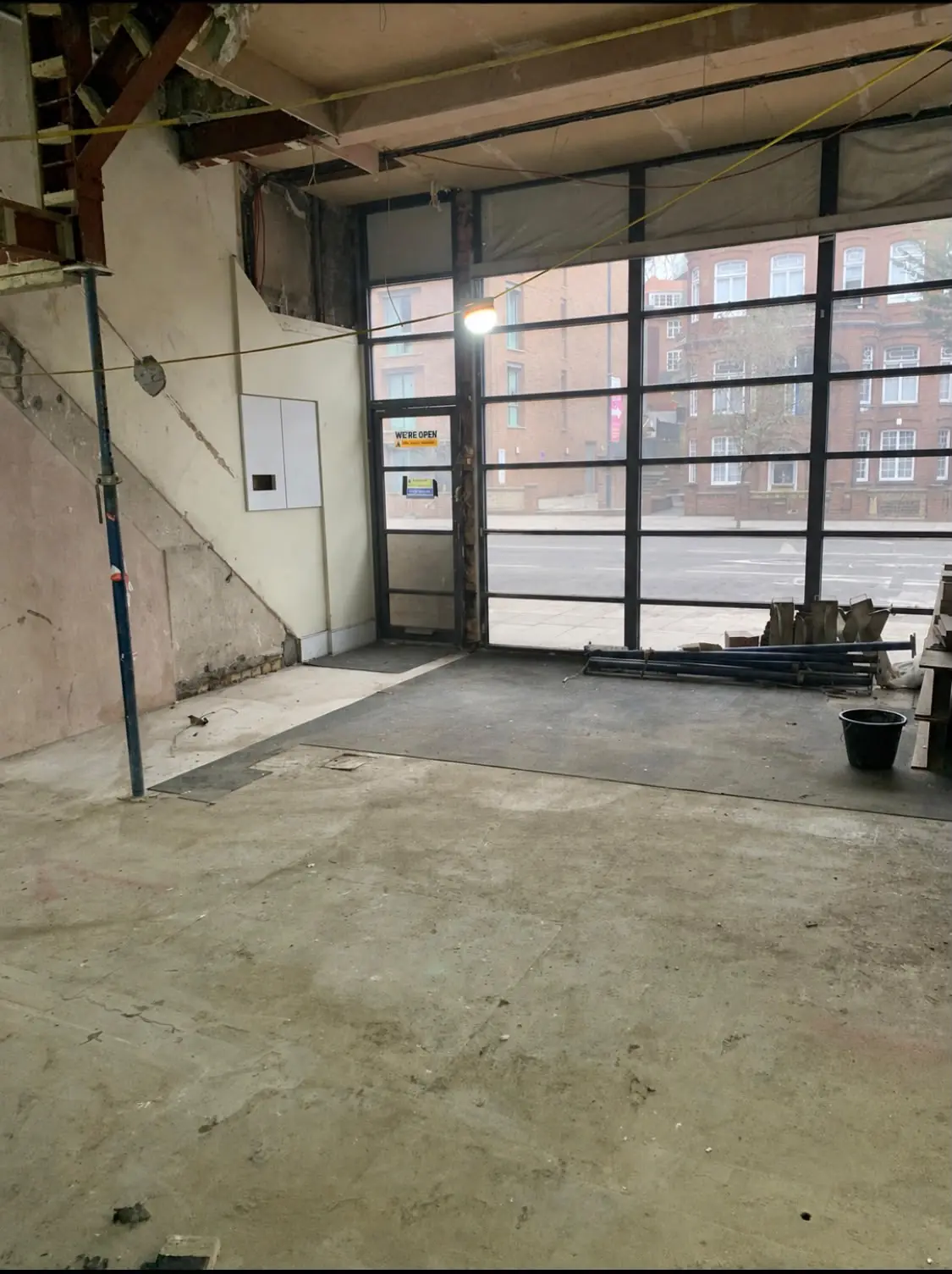 After. Floor swept end to end, daylight back through the shopfront.
