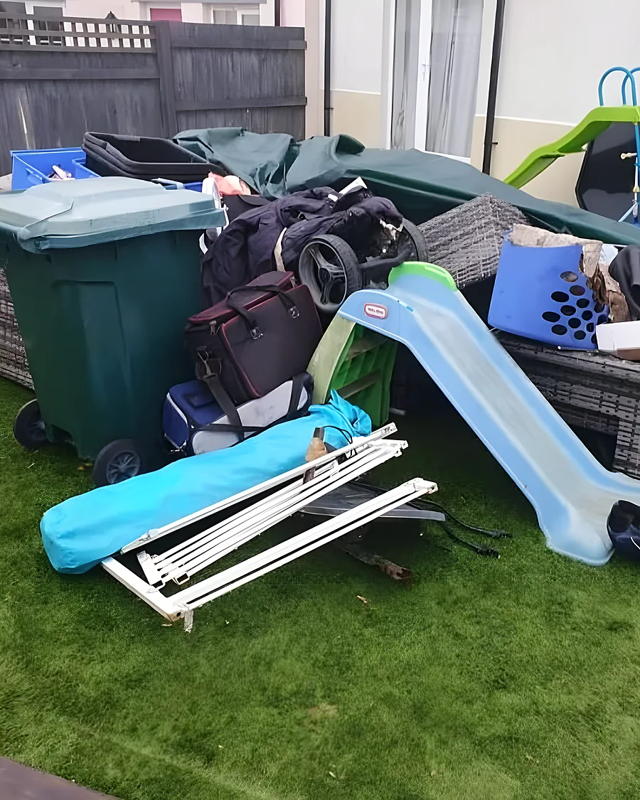 Before: Bins, garden furniture, a collapsed gazebo and children's toys heaped across the lawn.