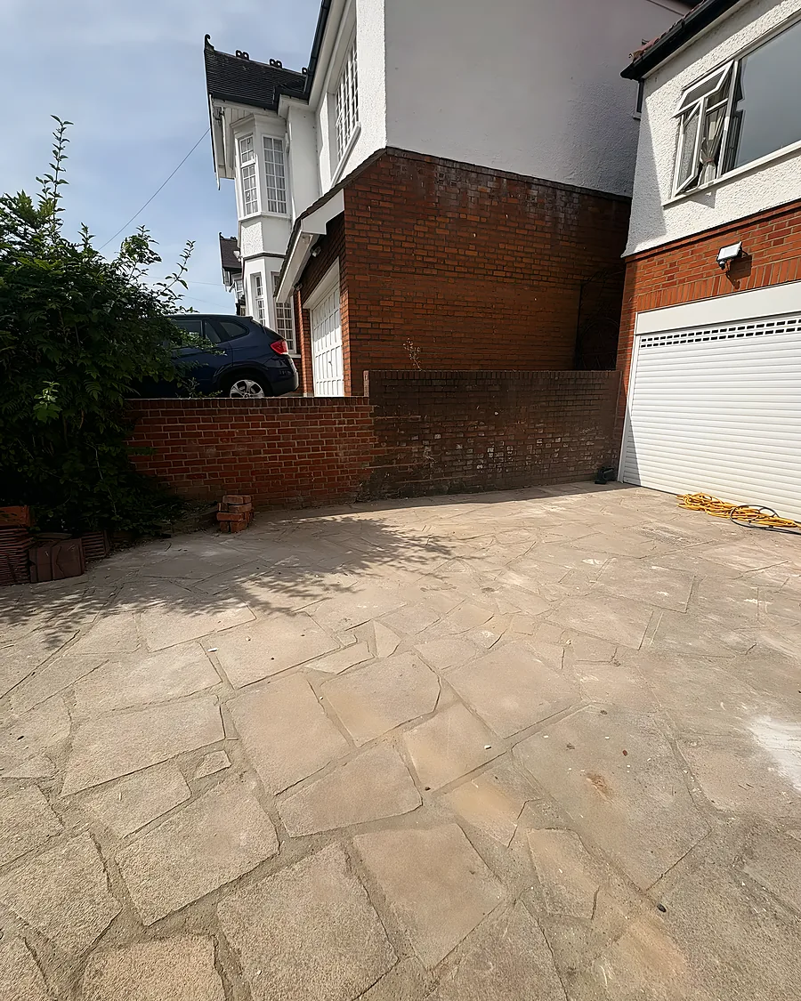After: Passage and patio cleared and swept, back to the brick and the paving.