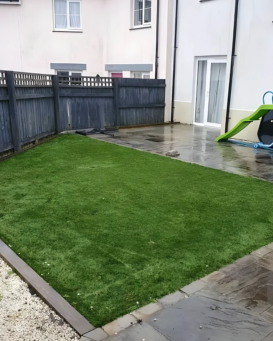 After: Cleared and a new lawn laid, slide and bench the only things standing.