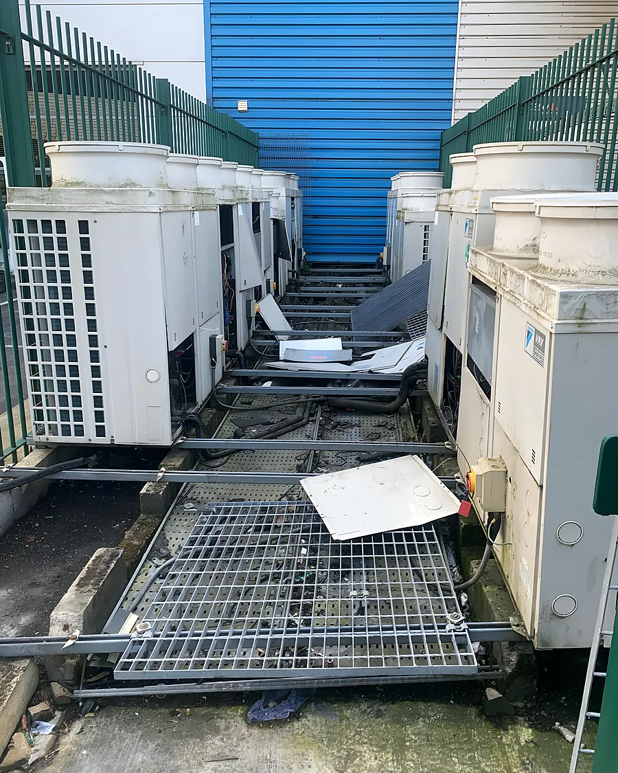 A bank of air-conditioning condensers on the plant deck of a commercial building