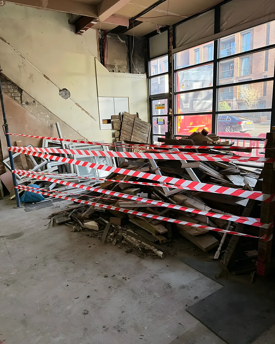 A commercial unit full of broken pallets, timber and debris